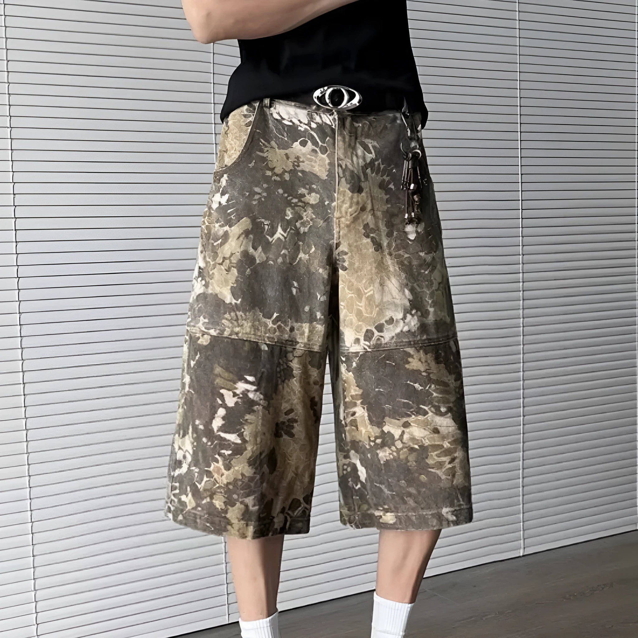 Yellow jeans with snake pattern camouflage design and cropped length