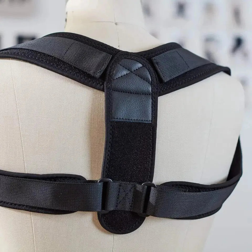 Black adjustable posture correction strap with elastic materials and shoulder pads