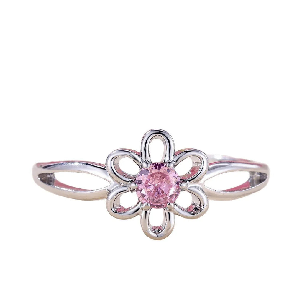Women's flower-shaped hollow-out copper fashion ring in platinum pink diamond colour.