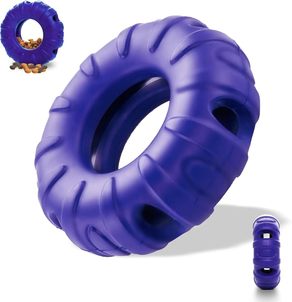 Blue natural rubber tyre-shaped dog chew toy and slow feeder with oval openings for treat dispensing.