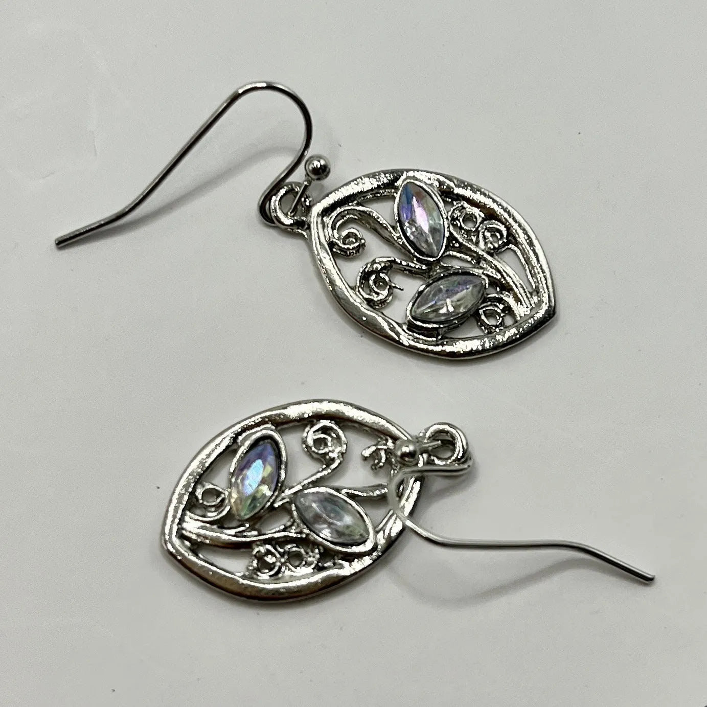 Silver-coloured alloy leaf earrings with embedded colourful moonstone gemstones for women.