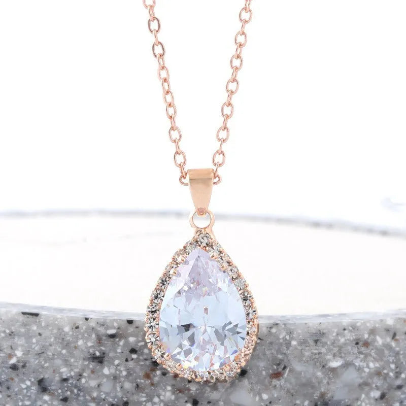 Women's rose gold electroplated rhinestone necklace with geometric water drop pendant in pink colour