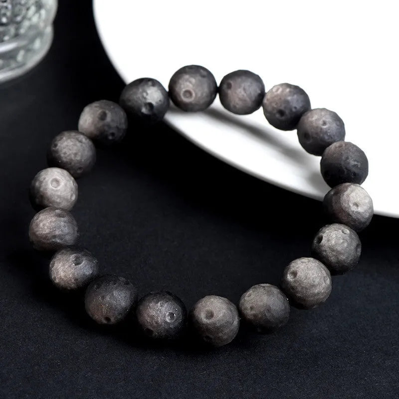 Obsidian crater ball bracelet with grinding texture in silver or gold meteorite finish