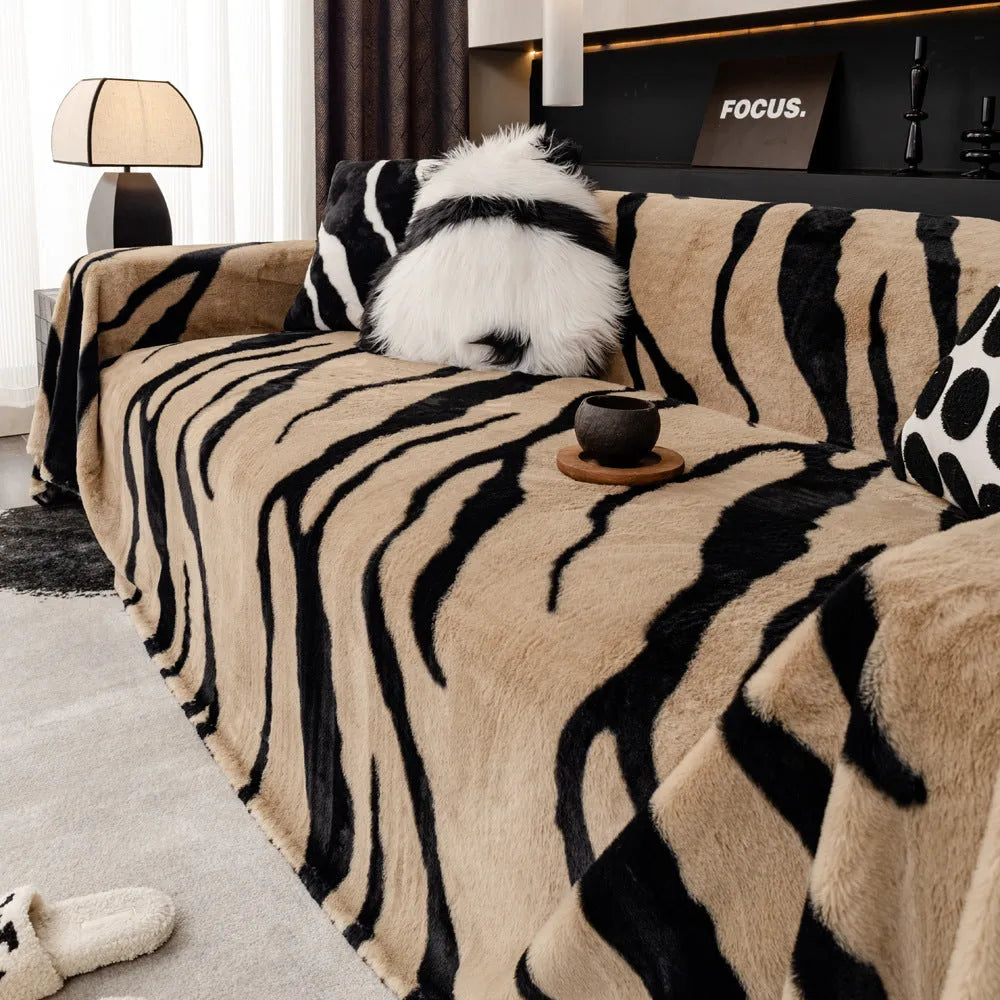 Zebra pattern flannel sofa cover with non-slip design shown on living room furniture