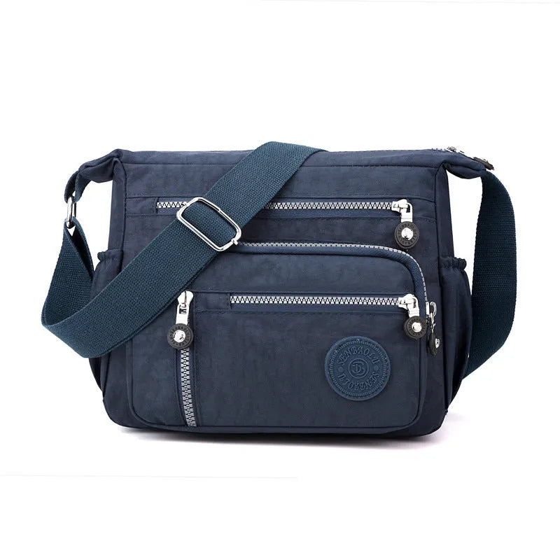 Gray nylon shoulder messenger bag with square vertical design and single strap