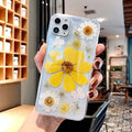 Pink and yellow floral design TPU back cover case for iPhone on a white background.