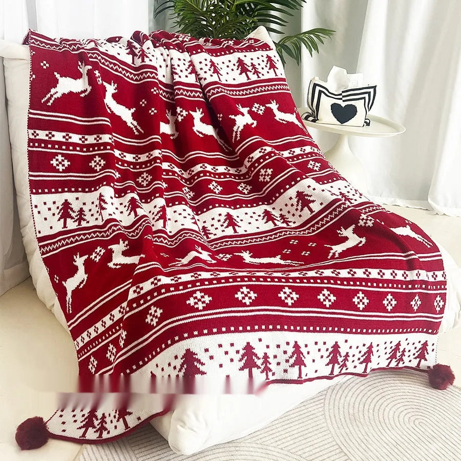 Personalised acrylic Christmas blanket with cartoon reindeer or snowflake pattern on sofa