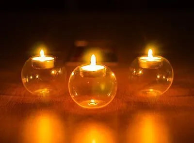 Clear round handmade hollow glass candle holder in three size options