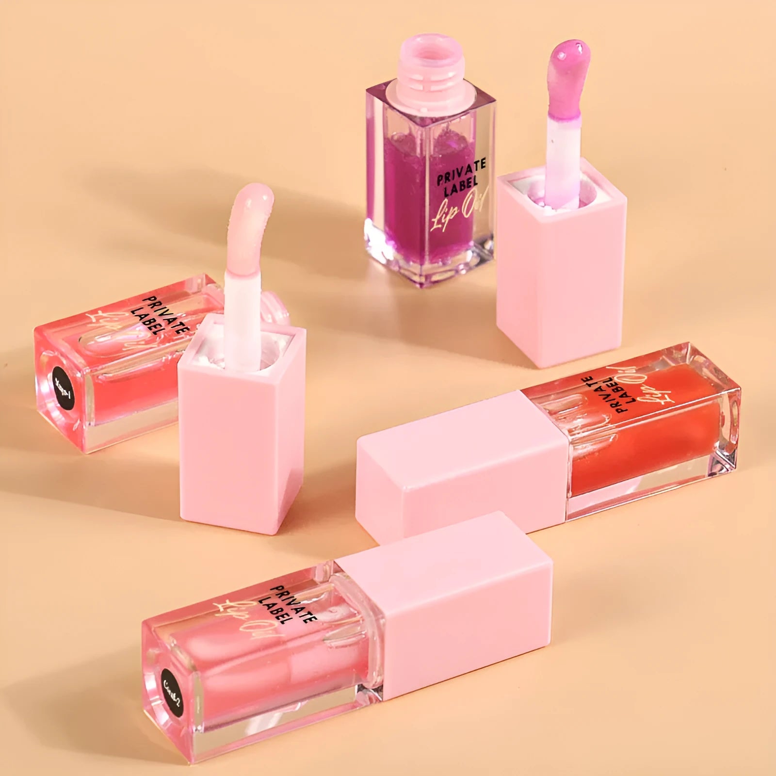 Set of six transparent women's lip glosses in 6ML tubes with various flavours.