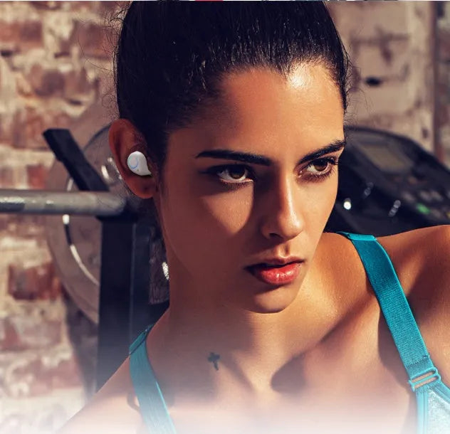Black and white M18 true wireless in-ear Bluetooth headset with charging case.