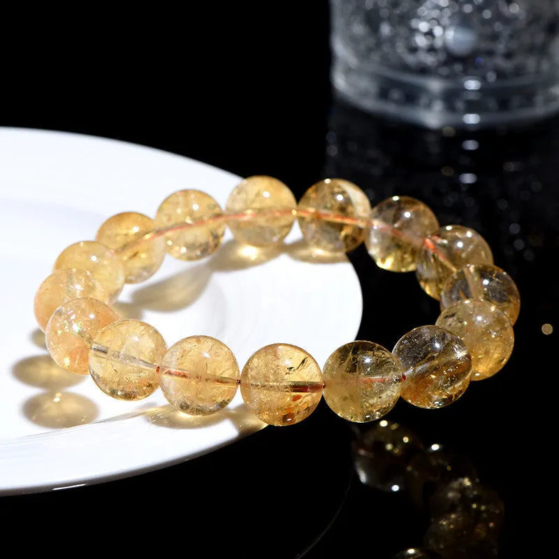 Natural yellow citrine bracelet with geometry-shaped beads in multiple size options on adjustable closure
