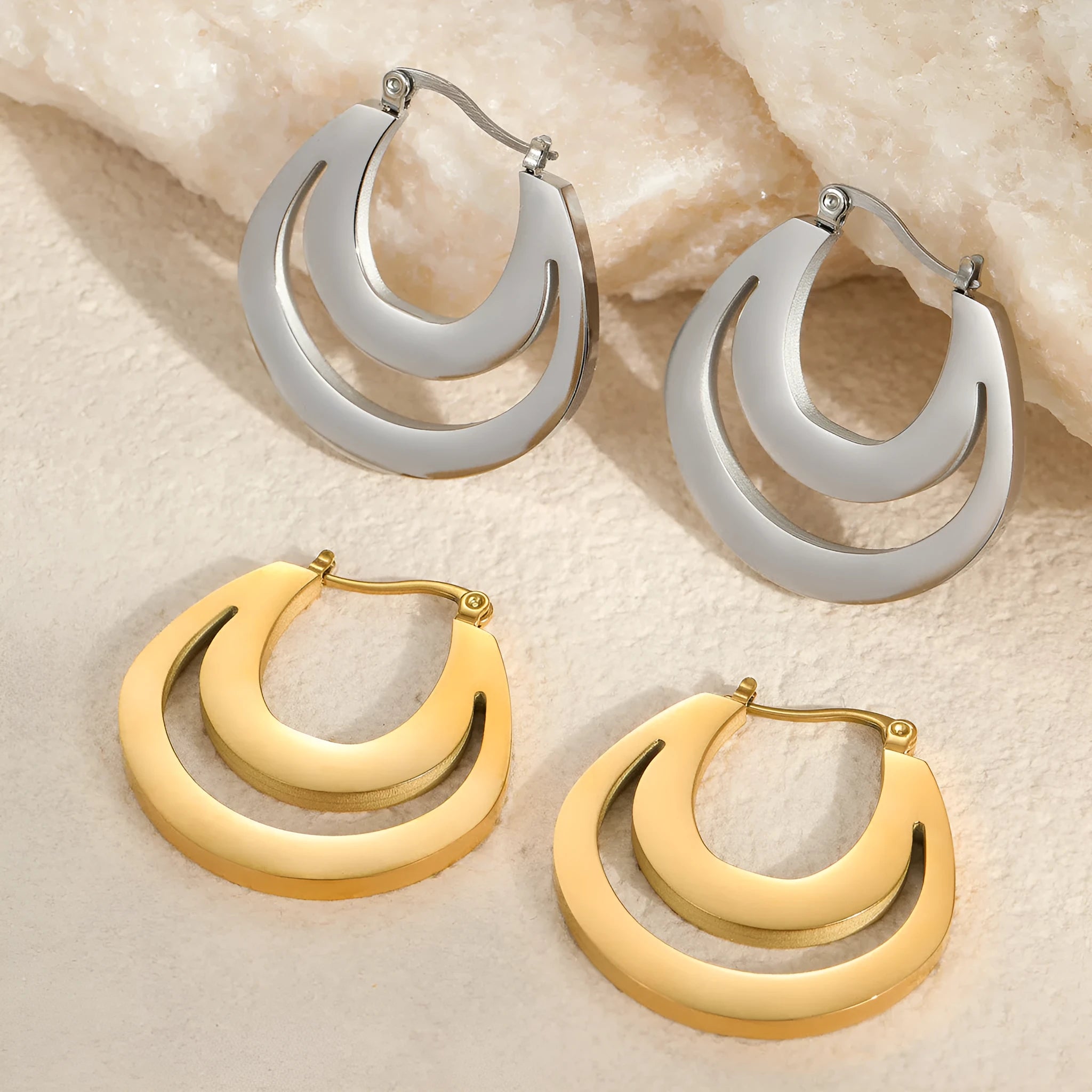 Geometric gold plated French earrings with round ring elements on stainless steel
