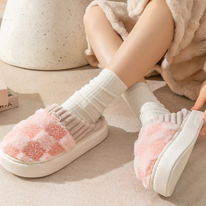 Plaid patterned women's indoor slippers in various colours with a soft sole and plush interior.