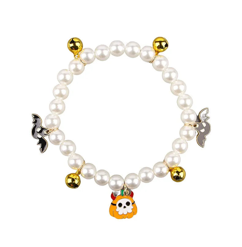 Purple Halloween cat collar with simulated pearl necklace decoration showing pumpkin designs