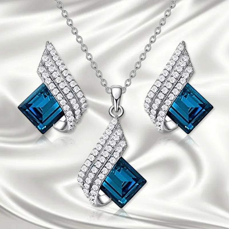 Women's alloy necklace and earring set with glass pendant featuring cross chain design