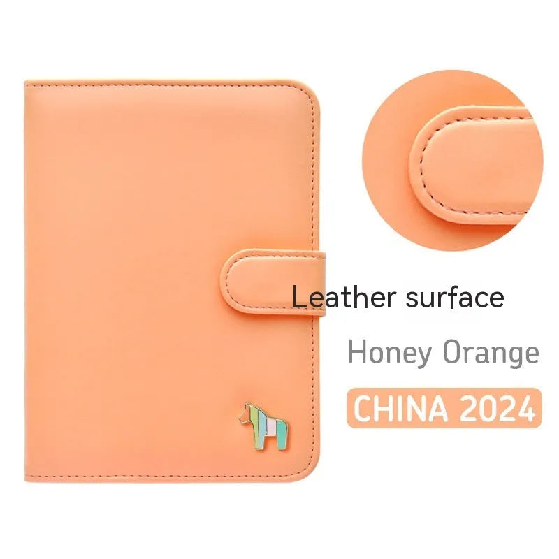 Compact leather-covered 396-day schedule book for hand accounting, shown lying open flat.