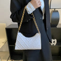 Black PU leather vertical square shoulder bag with chain strap, soft handle, and 3D outer pockets