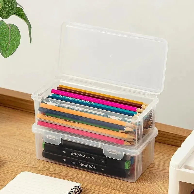 Transparent plastic pencil storage box with large capacity for crayons and colouring pencils.