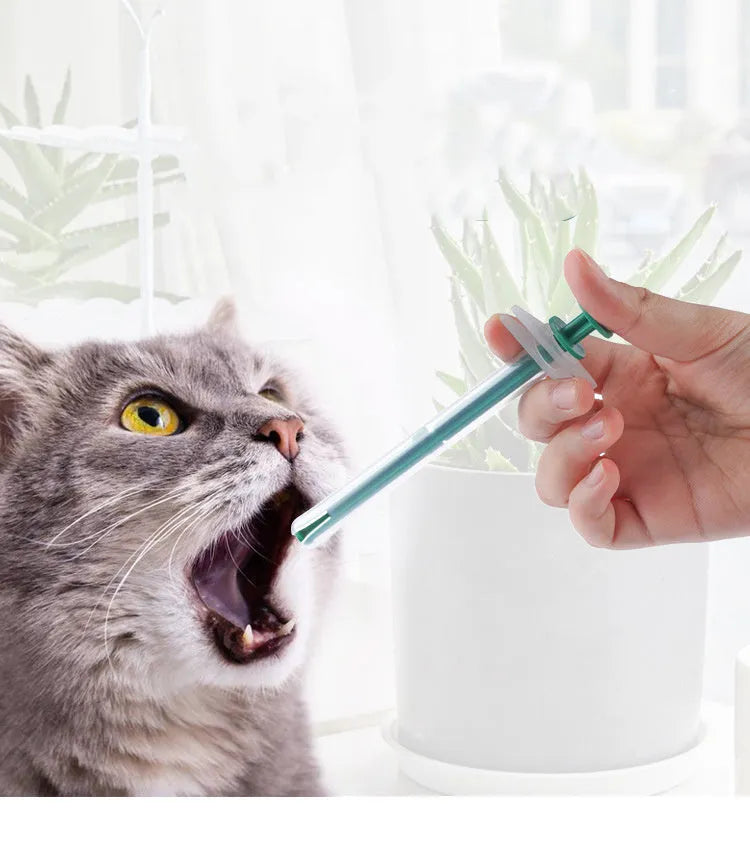 Two pet pill shooters with soft silicone tips, different sizes, for administering medicine to cats and dogs.