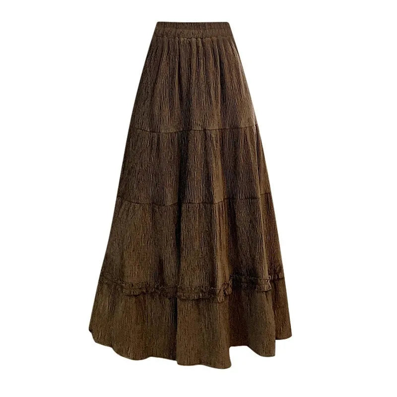 Korean style corduroy A-line midi skirt with elastic waistband in solid beige, black, or brown.