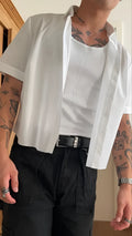 Men's plain white polyester short sleeve shirt with cropped top length on mannequin