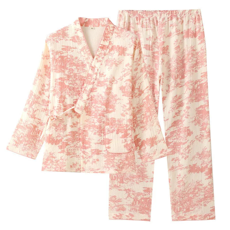 Women's pink cotton gauze long sleeve top and trousers lounge suit set on a hanger.