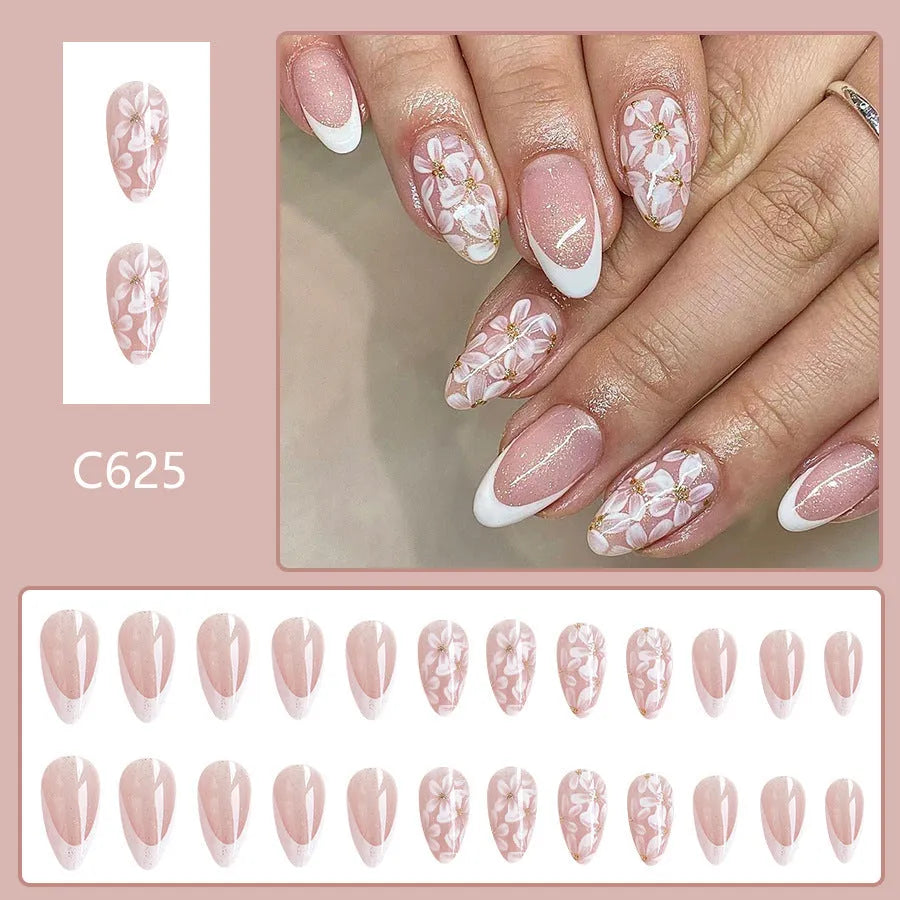 Short almond press on nails with French tip, flower pattern and glitter powder in C625 style