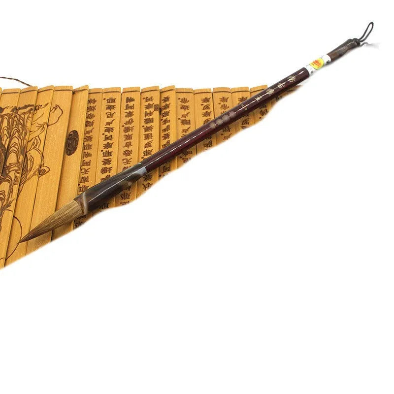 Set of three traditional Chinese calligraphy brushes with wolf hair bristles and steel ferrules in large, medium, and small sizes.