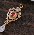 Water drop shaped pendant with hollow crown design and zircon detailing in five colour options