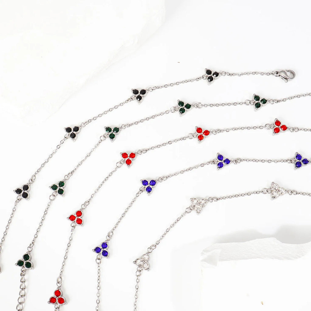 Stainless steel women's bracelet with three geometric diamond charms and zircon gemstones
