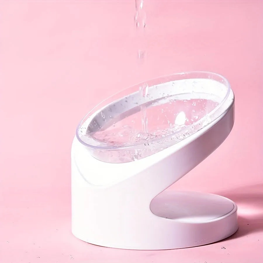 White elevated plastic cat food bowl with clear dish on a tilted stand
