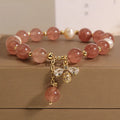 Women's bracelet with freshwater pearls, strawberry quartz beads, zircon accents, and an alloy clasp.