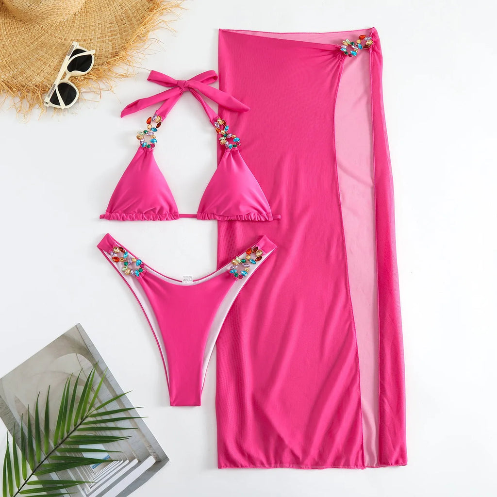 Rose red three-piece swimsuit set with bikini top, pants, and a long mesh skirt.