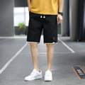 Men's loose-fit casual beach shorts in a South Korea style, shown in a green colour.
