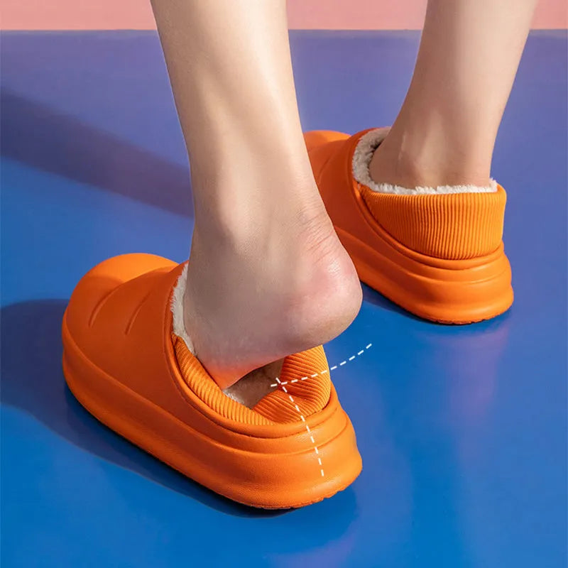 Waterproof EVA couple slippers in various colours showing hollow design and flat non-slip sole.