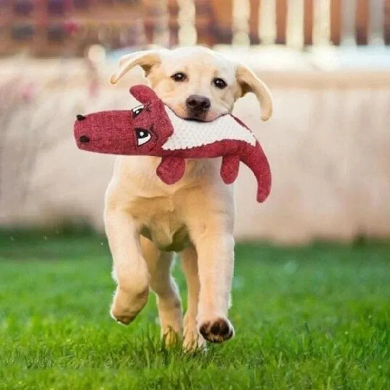 Plush corn-shaped pet toy with squeaker in blue, green, or red for chewing and grinding.