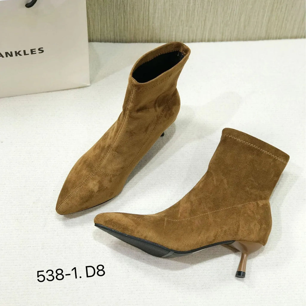 Women's black ankle boots with pointed toe and stiletto heel, mid-calf length