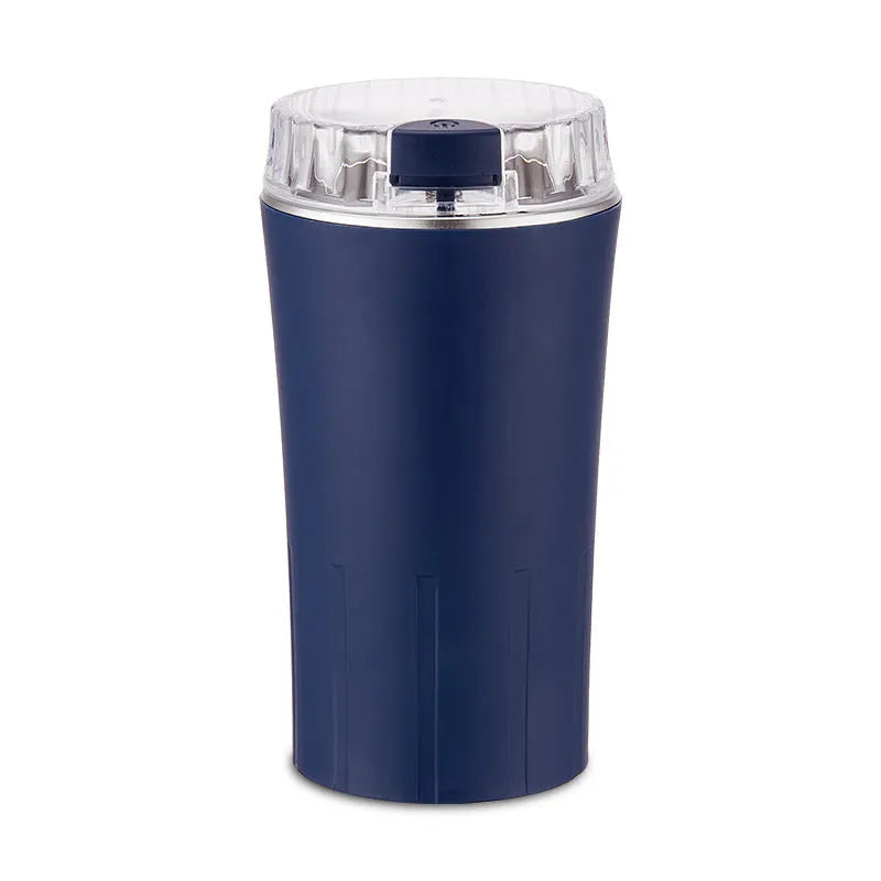 Blue mini flour mill grinder with stainless steel mechanism for grinding spices and grains.