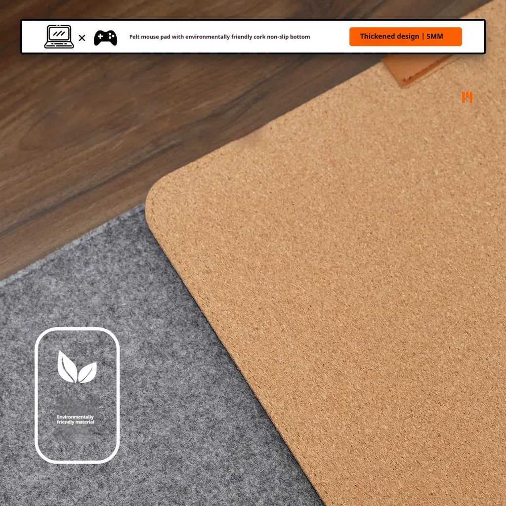 Winter warm grey and black felt desk mouse mat with cork non-slip base on a wooden table.