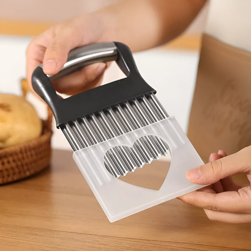 Stainless steel potato wave knife with a wavy blade on a kitchen worktop