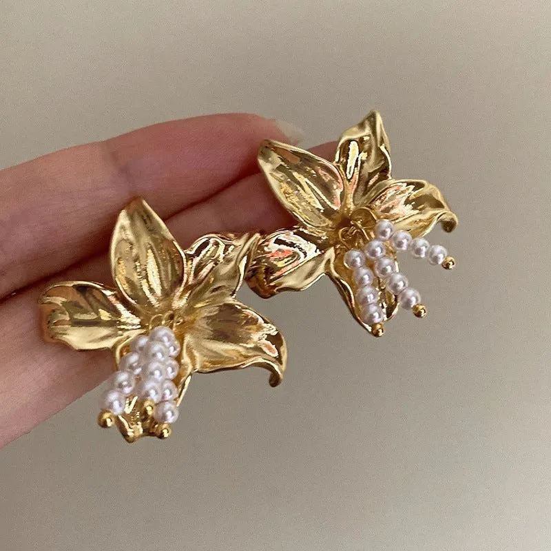 Golden flower earrings with pearl designs and exaggerated floral shape for women