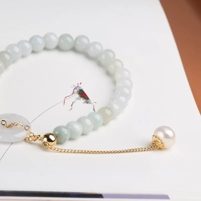 Natural emerald green jade and pearl bracelet with geometric peace buckle closure