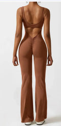 Women's black seamless hollow out yoga bodysuit with mid waist and trousers length.