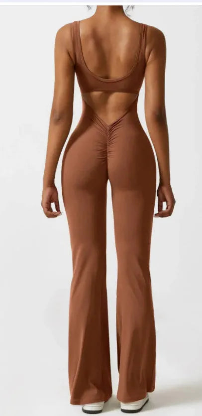 Women's black seamless hollow out yoga bodysuit with mid waist and trousers length.