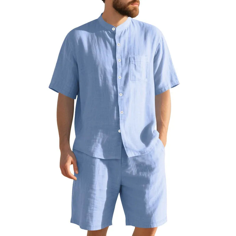 Man wearing a light-coloured short sleeve linen shirt and matching shorts from a casual summer suit set.