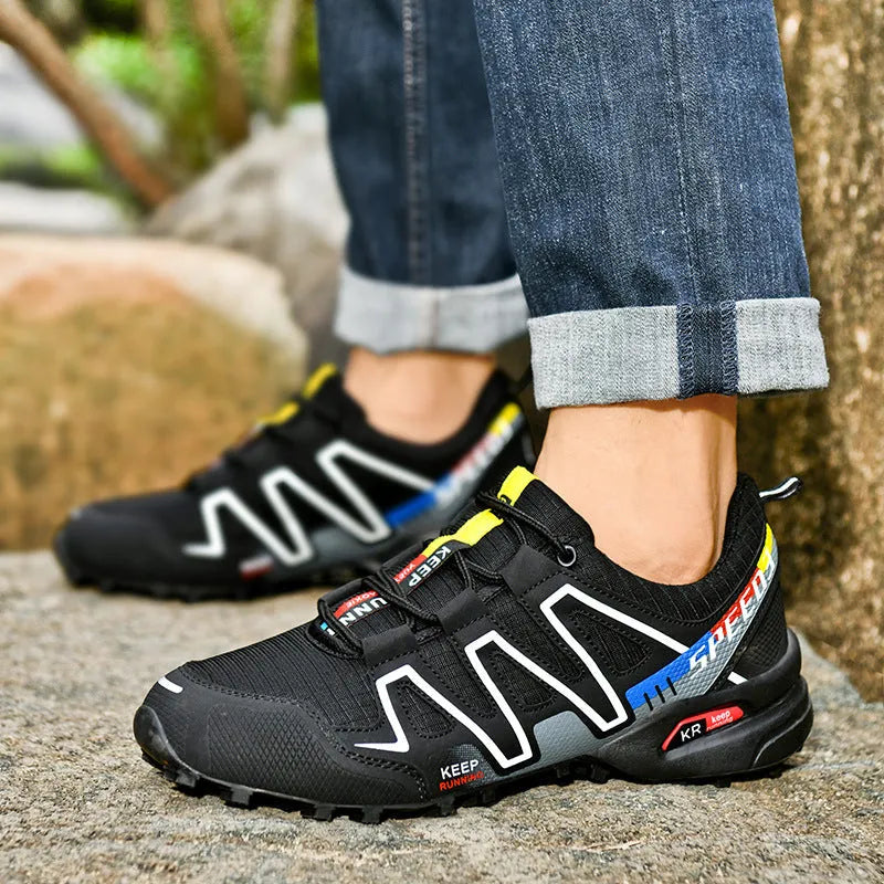 Men's grey orange plus size casual running shoes with low-top design on a plain background.