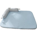 Blue pet cooling mat with big-eyed monster print on a wooden floor