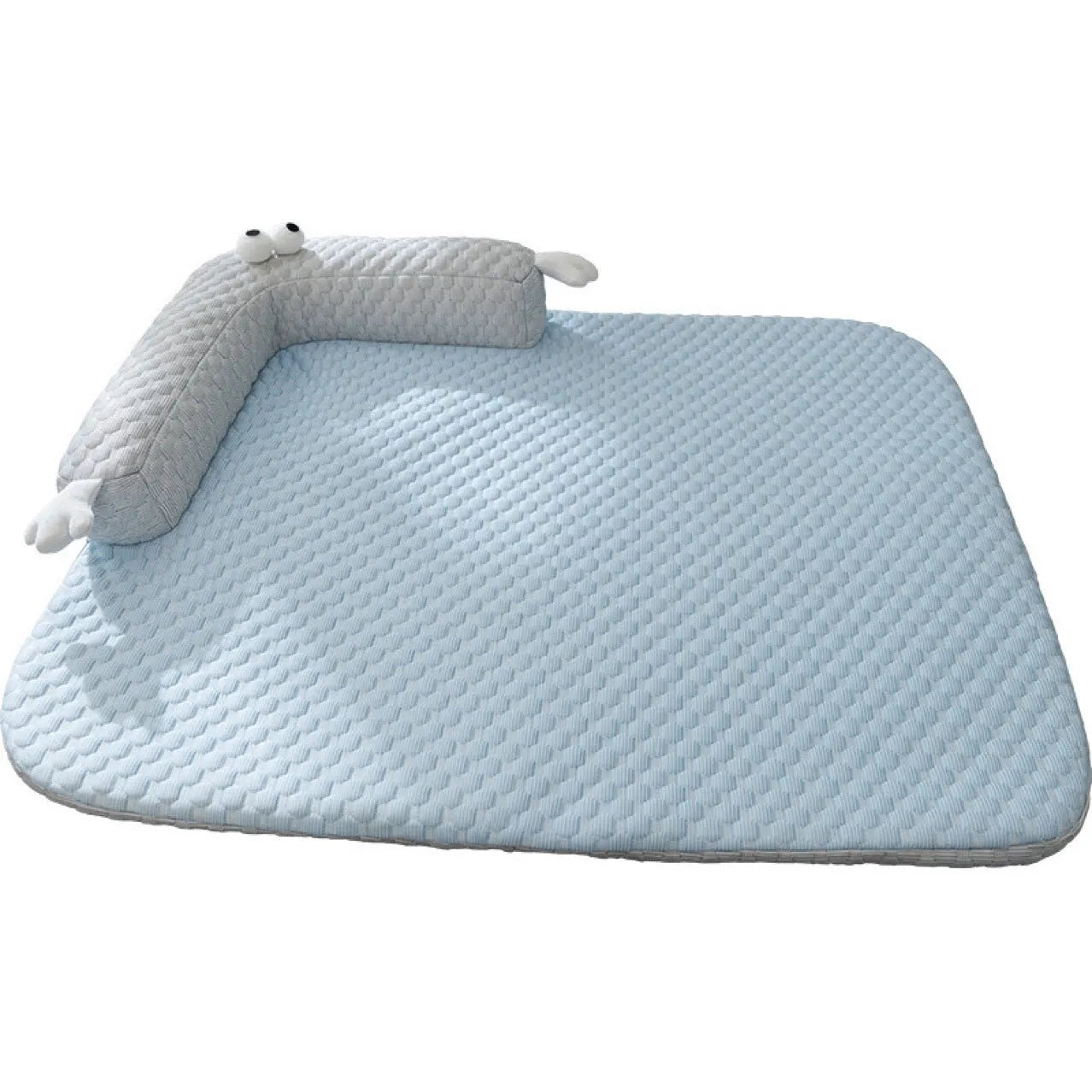 Blue pet cooling mat with big-eyed monster print on a wooden floor