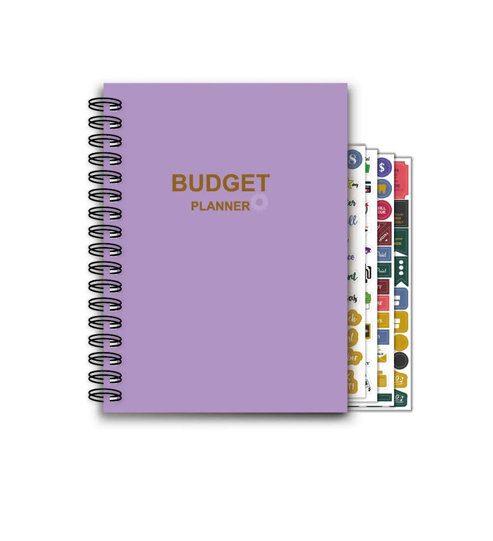 Purple coil-bound financial planning notebook with budget stickers and paper clips on A5 page
