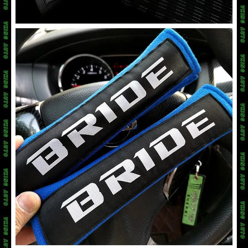 Car seatbelt shoulder pads in black, blue, and red colours showing cotton and sponge cloth embroidery weave construction